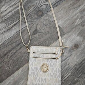 Milan cream, gold, gray crossbody purse with M lettering.